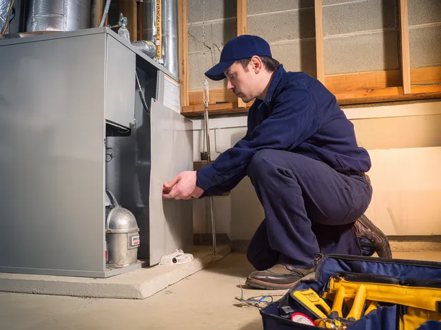 HVAC professional installing new ductwork in a residential attic